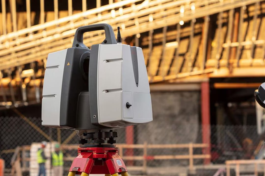 3D laser scanner on a tripod at a construction site.